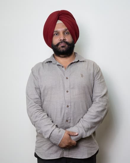 Dr. Arvinder Singh Bali, BAMS, hands folded, facing the camera