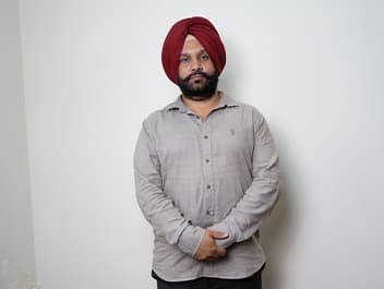 Dr. Arvinder Singh Bali, BAMS, hands folded, facing the camera