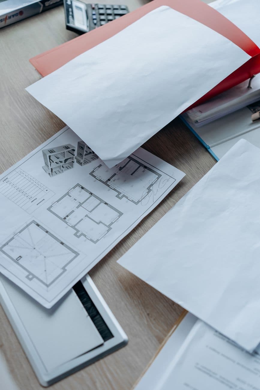 A printed document on a minimal desk, viewed from above